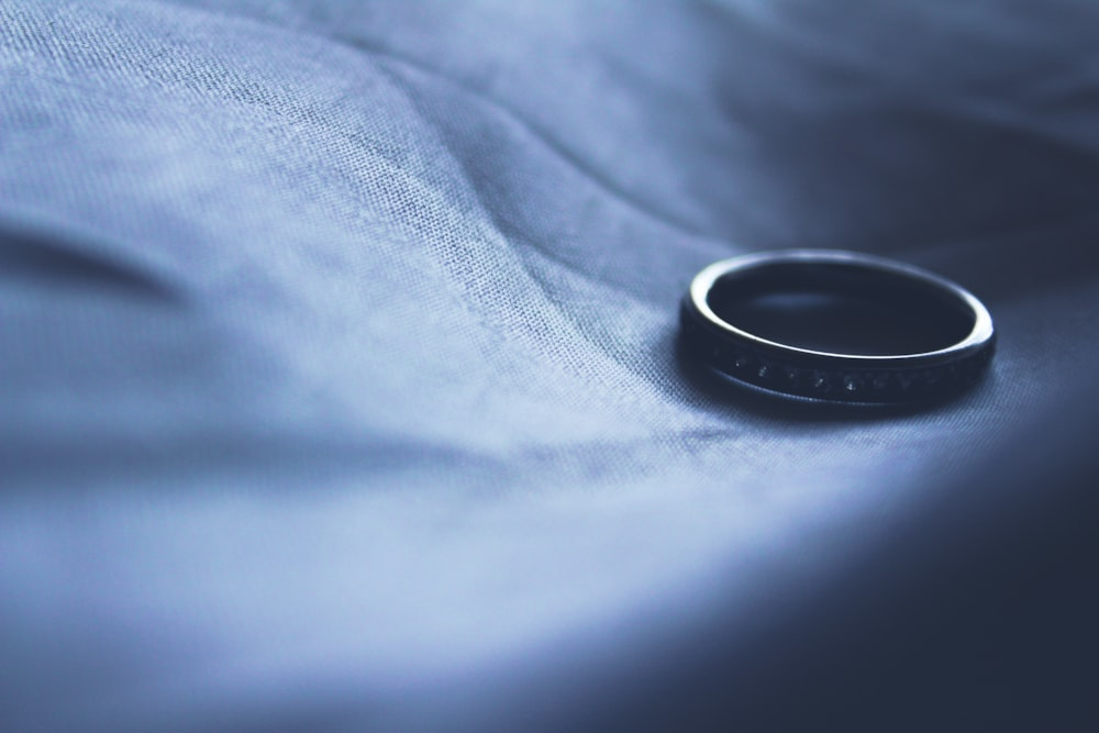 A marriage ring on a fabric surface