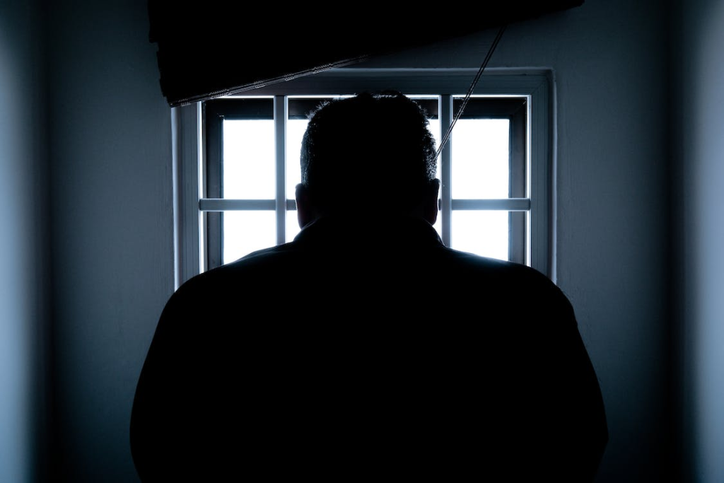 incarcerated-man-rear-view-silhouette