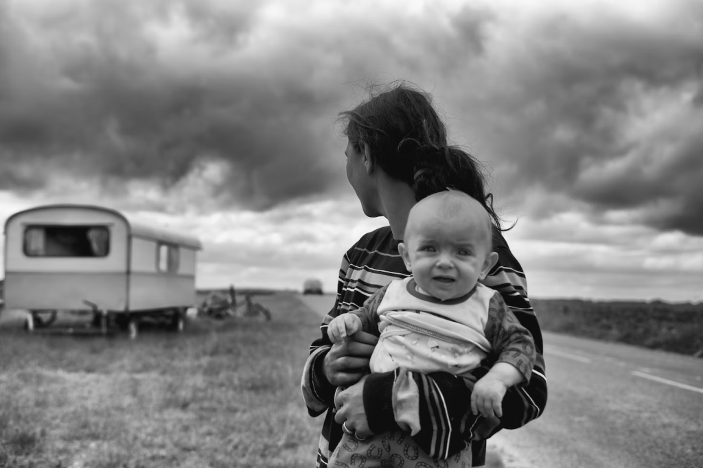 a woman holding her visibly upset baby