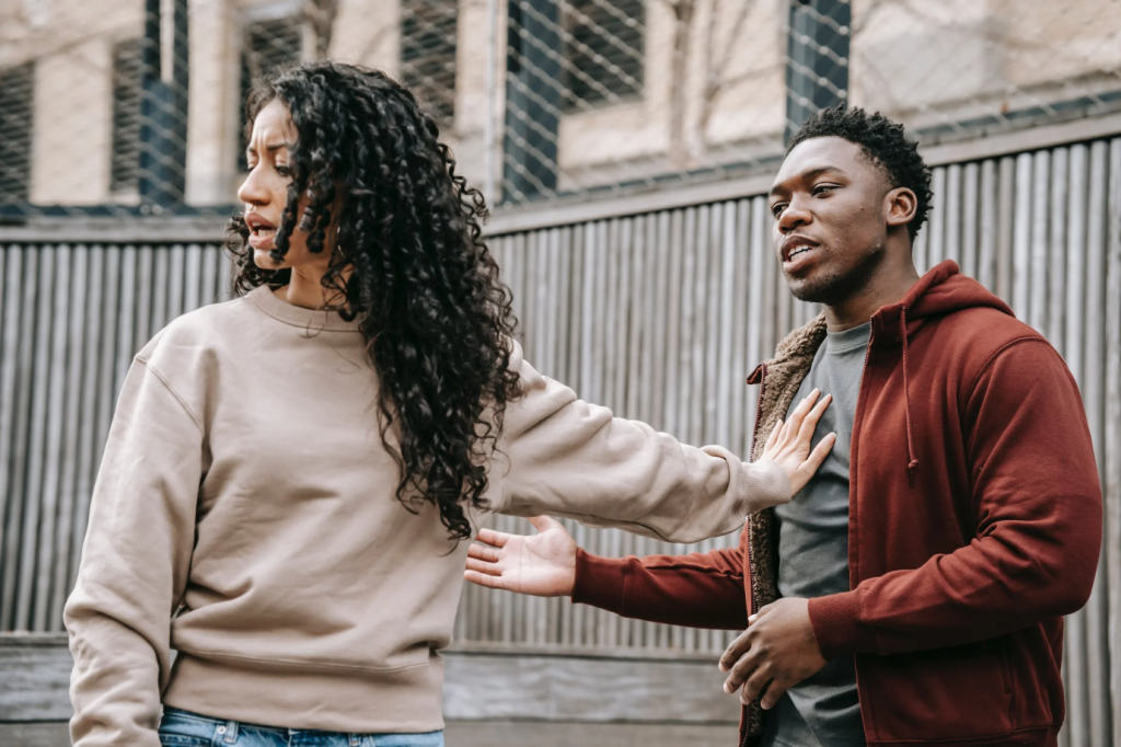 a woman telling her partner off after catching him cheating