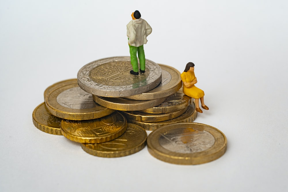 A couple of miniature figures on coins