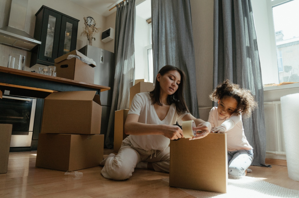 A parent and child moving