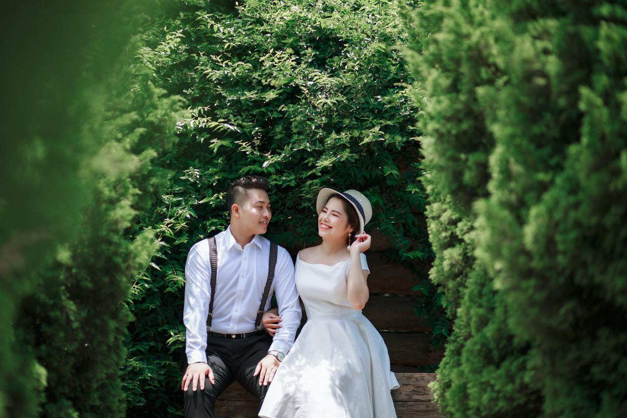 A married couple sitting on a bench