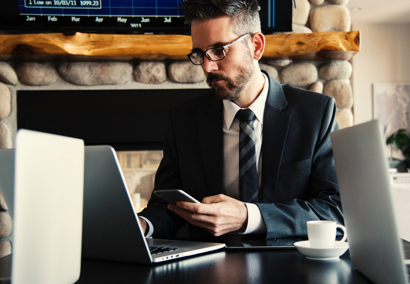 A divorce attorney holding his phone and working