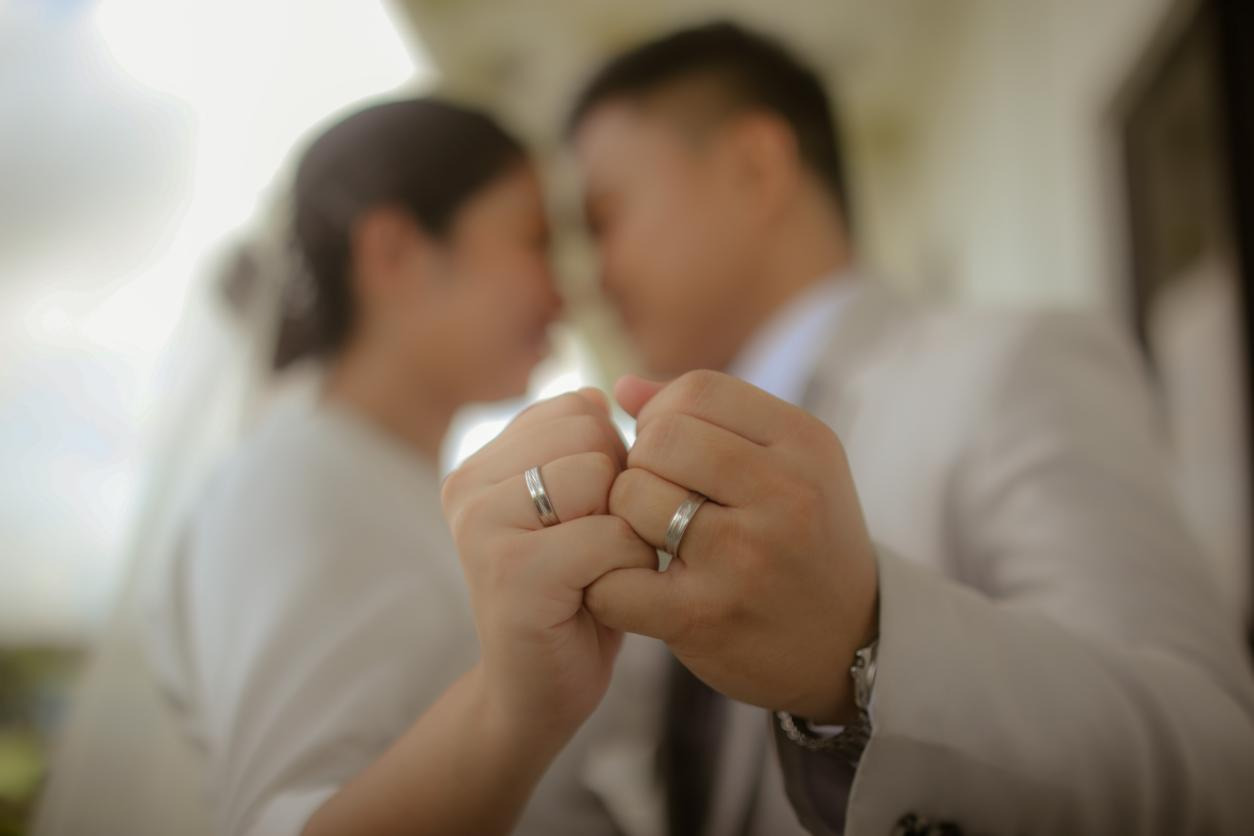 A married couple posing for a picture