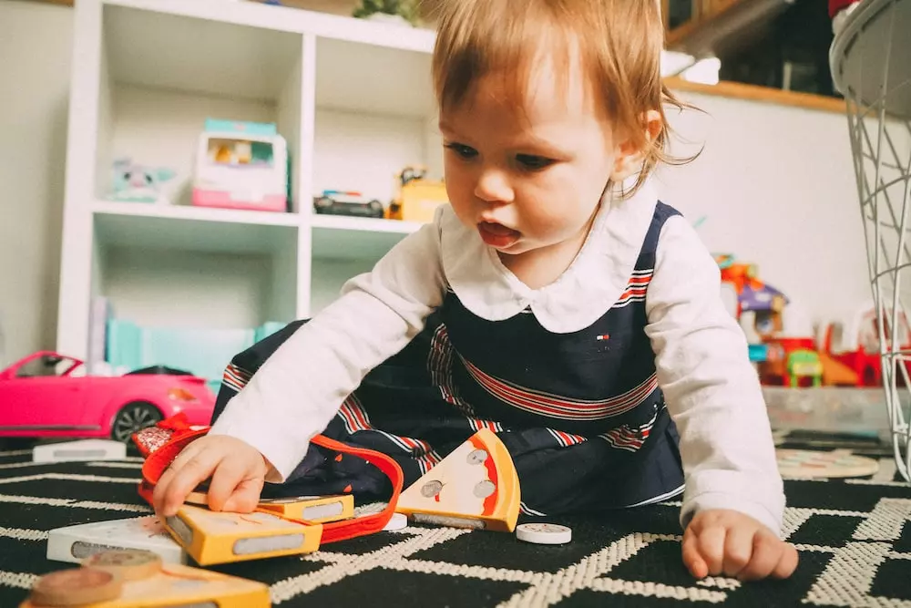 Young child playing with toys.