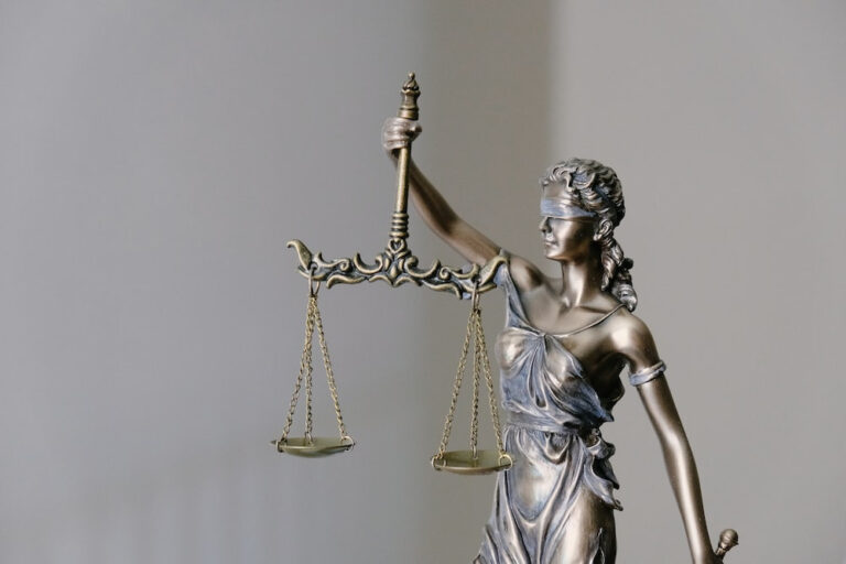figure holding a balance