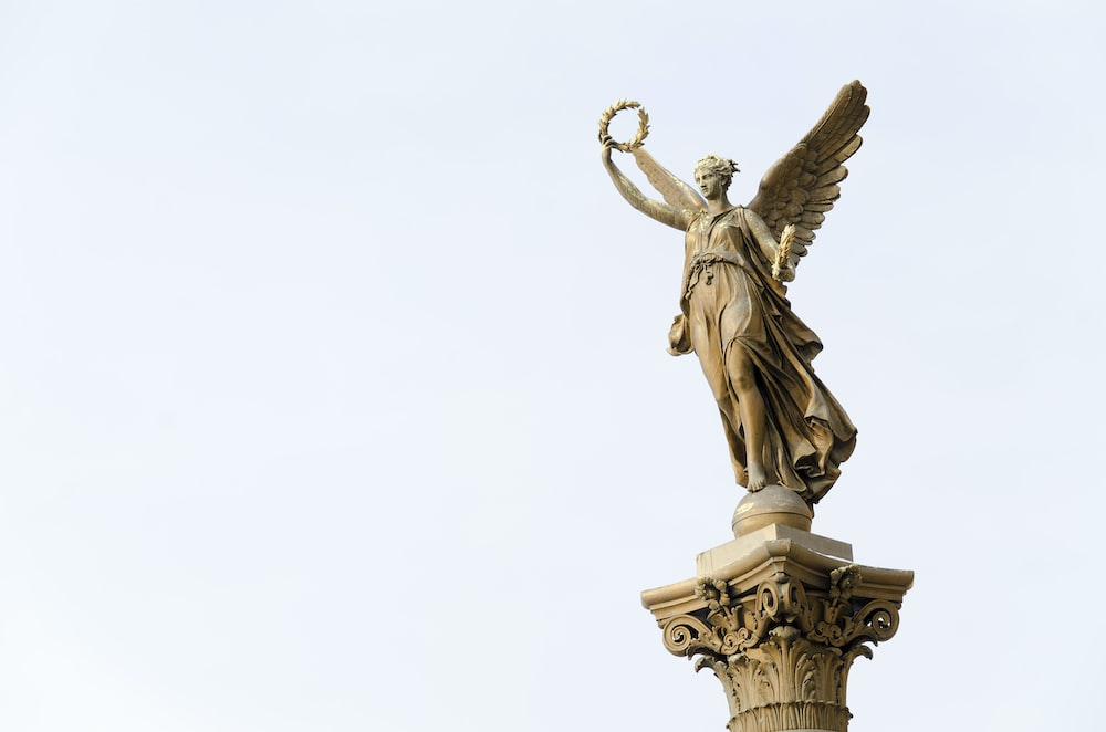 figure holding a wreath