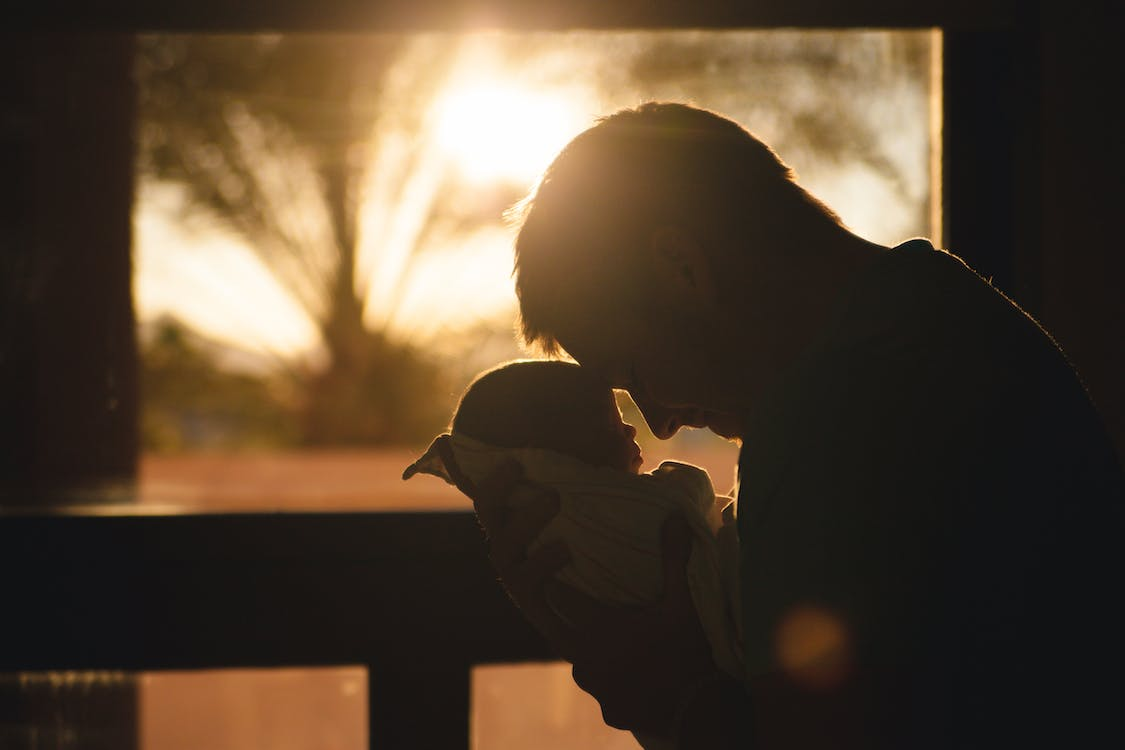 A father holding his newborn