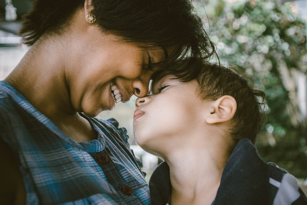A woman hugging her son