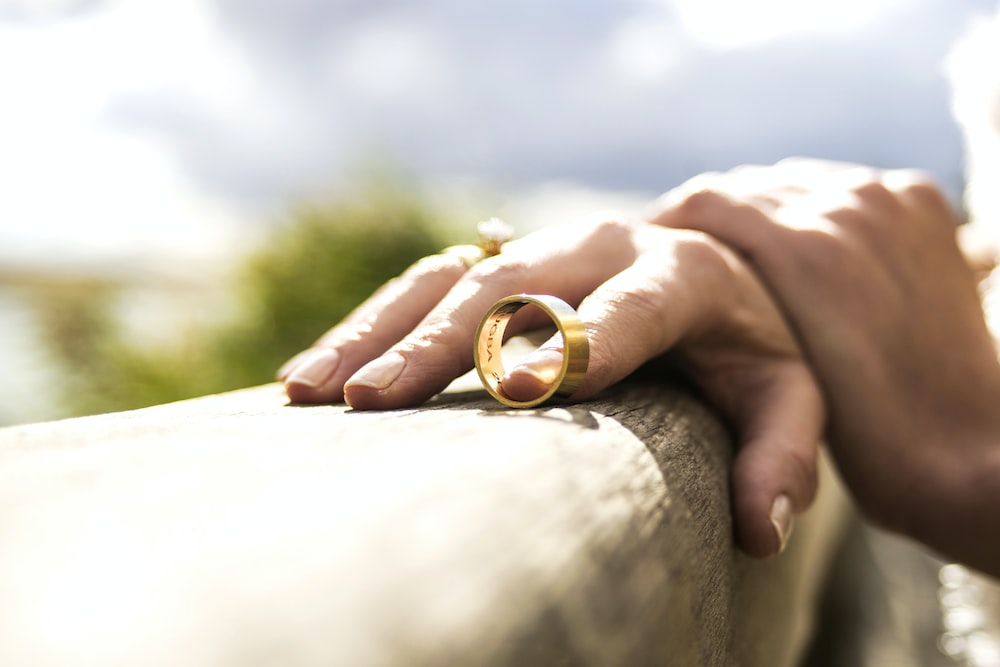 A woman holding her wedding ring