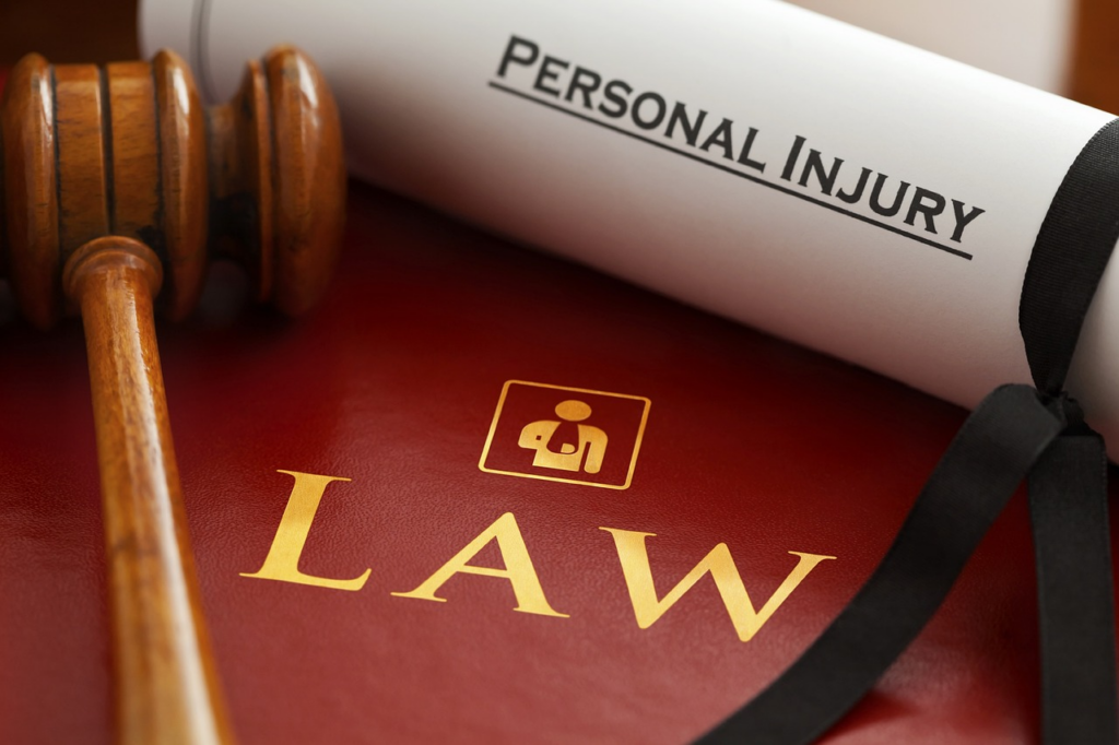 A gavel and a legal book labeled ‘Personal Injury Law’signifying the pursuit of justice in personal injury cases.