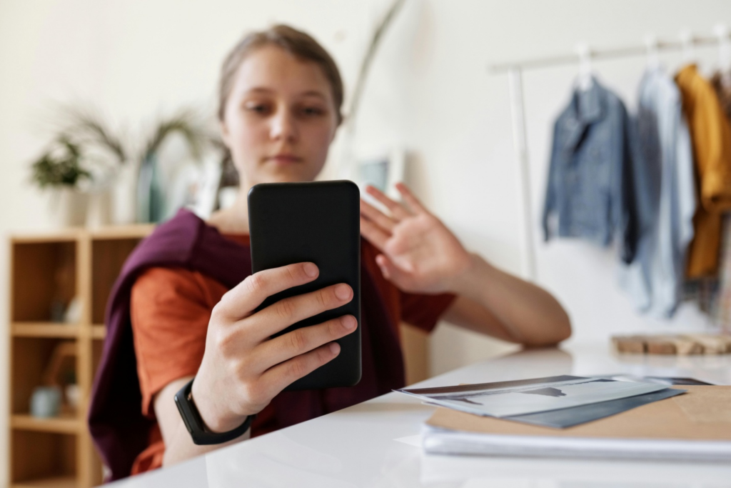 A girl talking with her mother on a video call