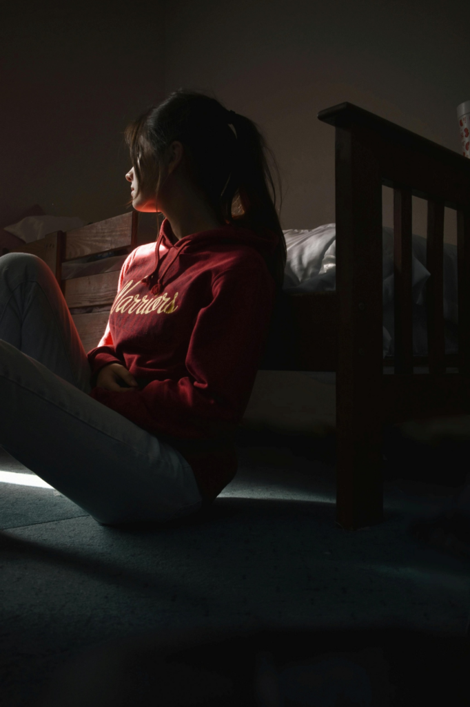  A sad-looking woman sitting on the floor