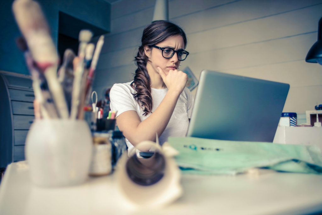 A woman researching on a laptop