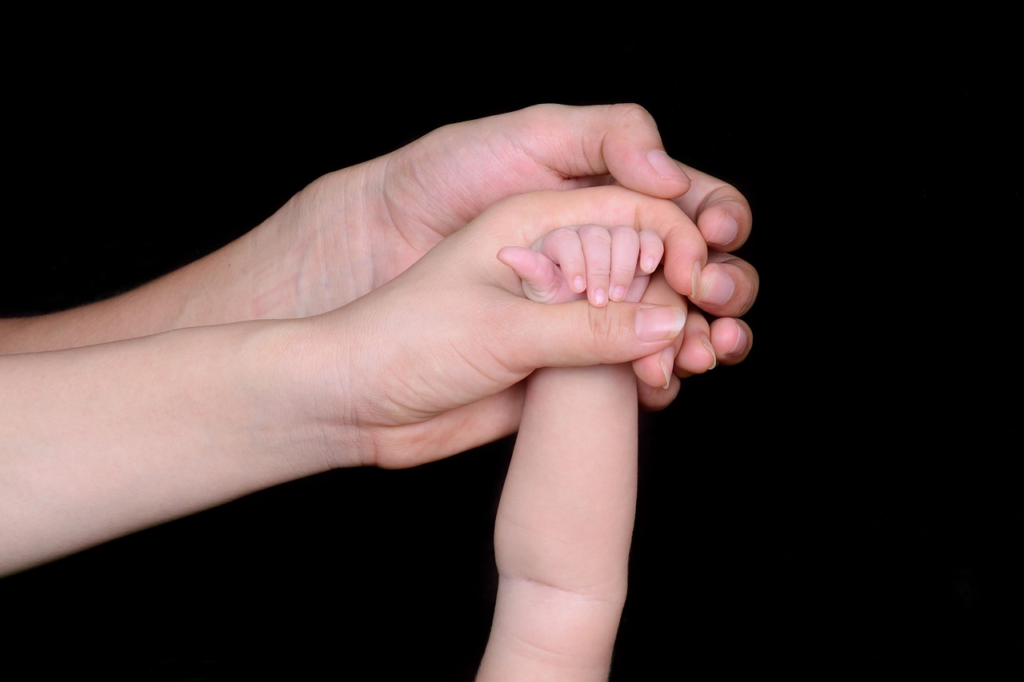 A family holding hands