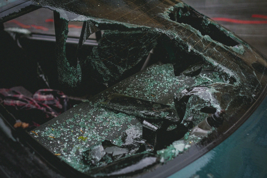 A shattered windshield of a car