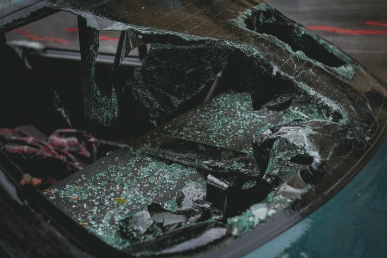 A shattered windshield of a car