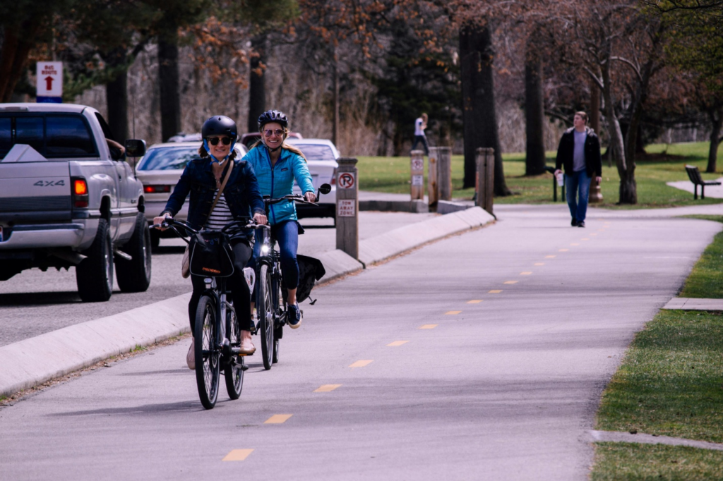 Two women cycling on the road