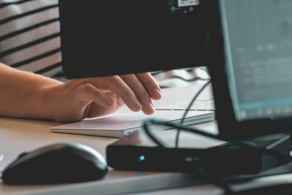 A person typing on a keyboard