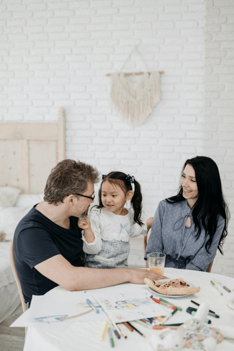 A couple with their adopted child