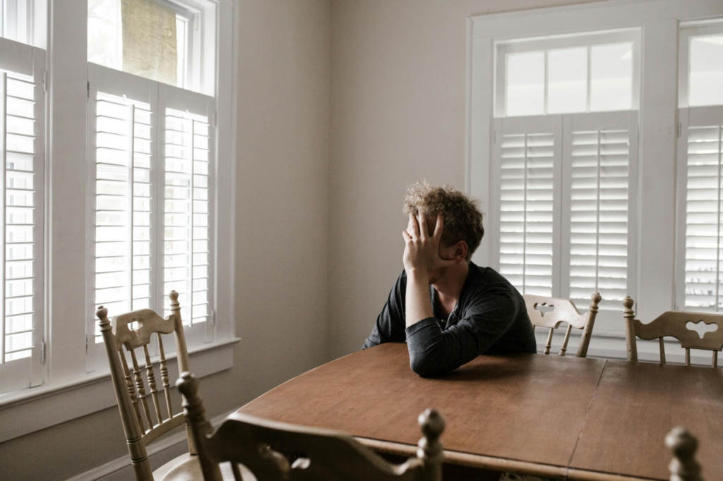 A stressed person sitting on a chair