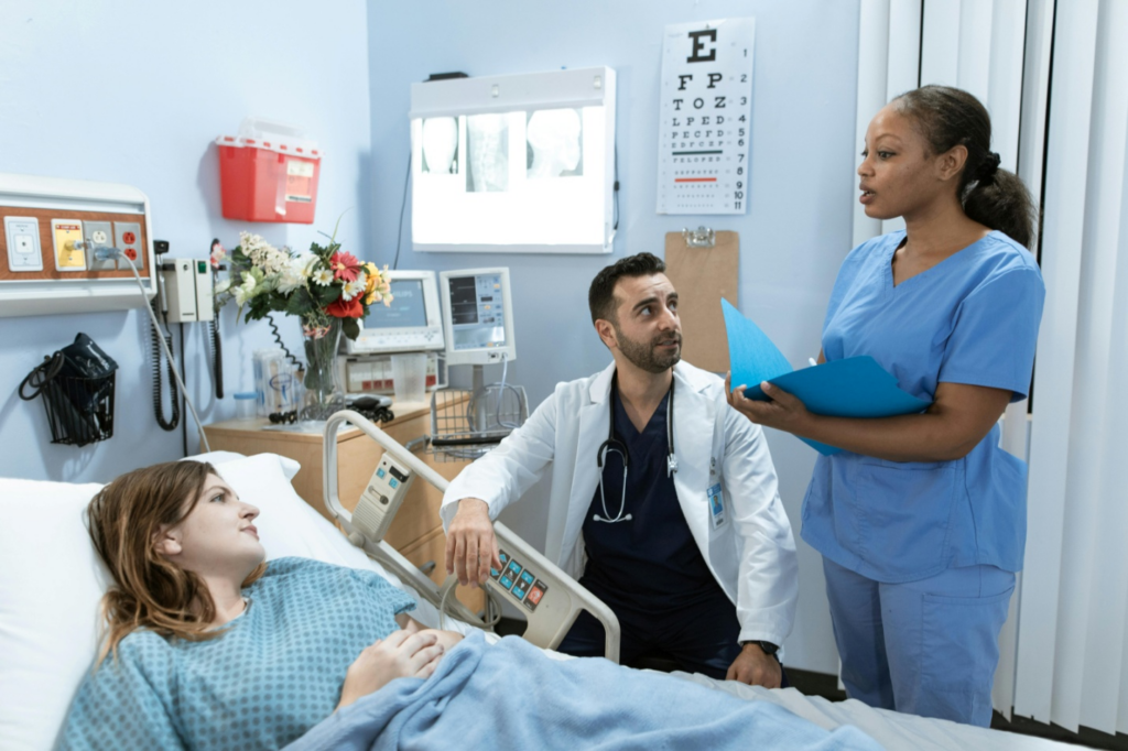 A doctor and a nurse attending to a patient
