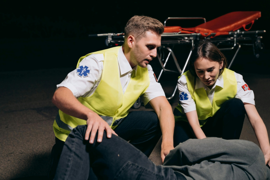 Medical professionals attending to an injured person