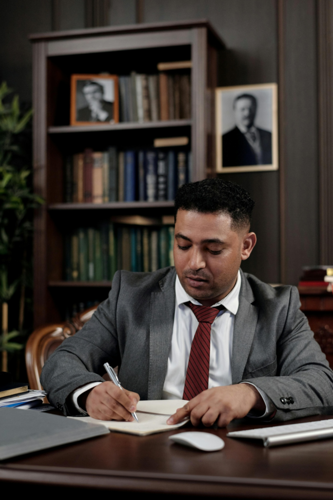 A lawyer writing on a notepad