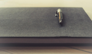 A lawyer’s notebook and pen