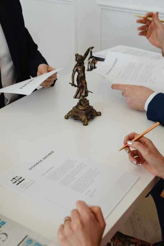 A couple signing divorce decrees
