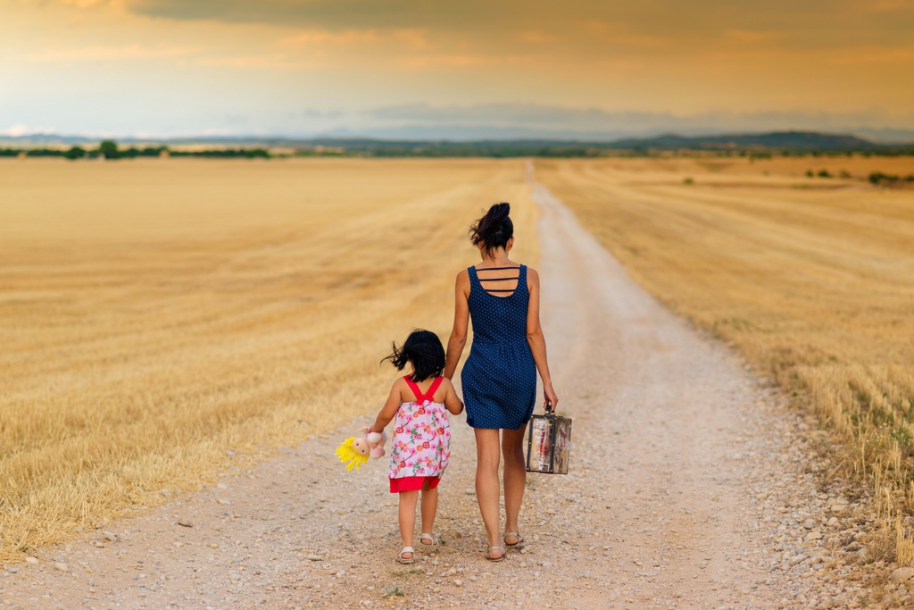A mother and daughter taking a walk together