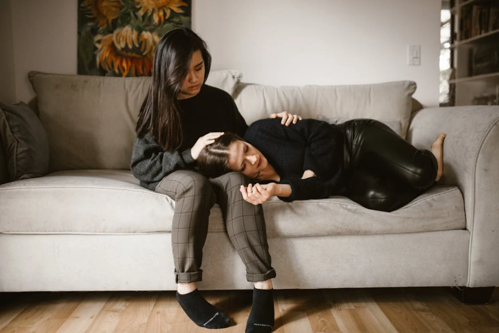 An image of two women sitting on a couch