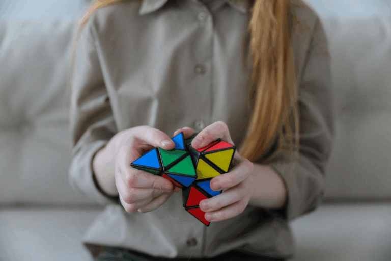 A kid fiddling with a pyraminx
