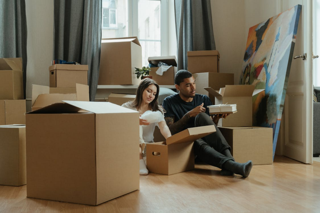 A couple unpacking after moving in together