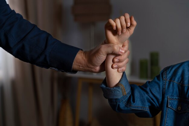 A person holding another person's arm