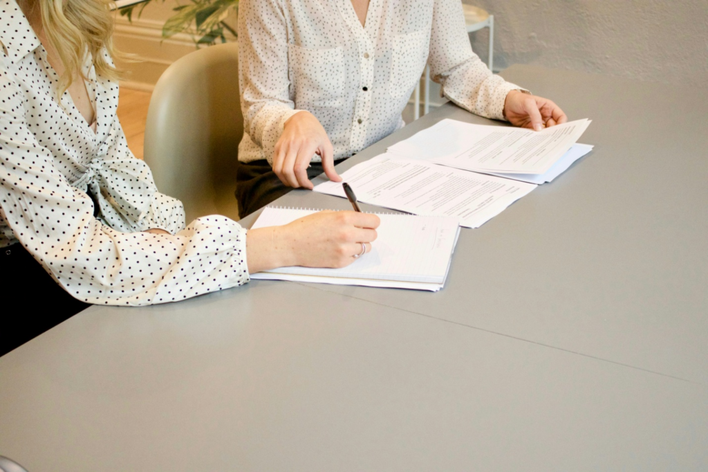 Two women reviewing a document