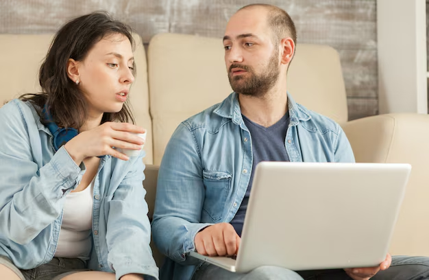 A couple looking at a laptop