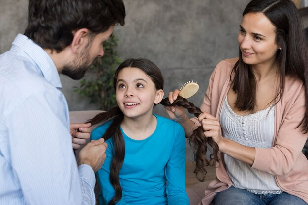 A girl with her parents