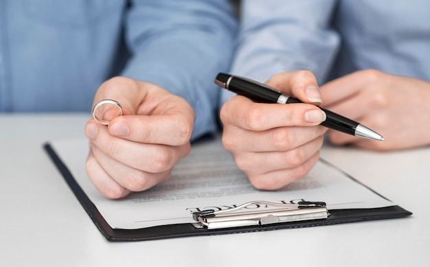 A couple reading a divorce agreement