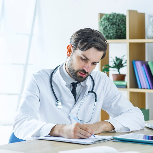 A medical practitioner in his office