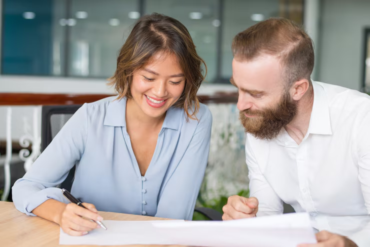 A couple preparing a contract