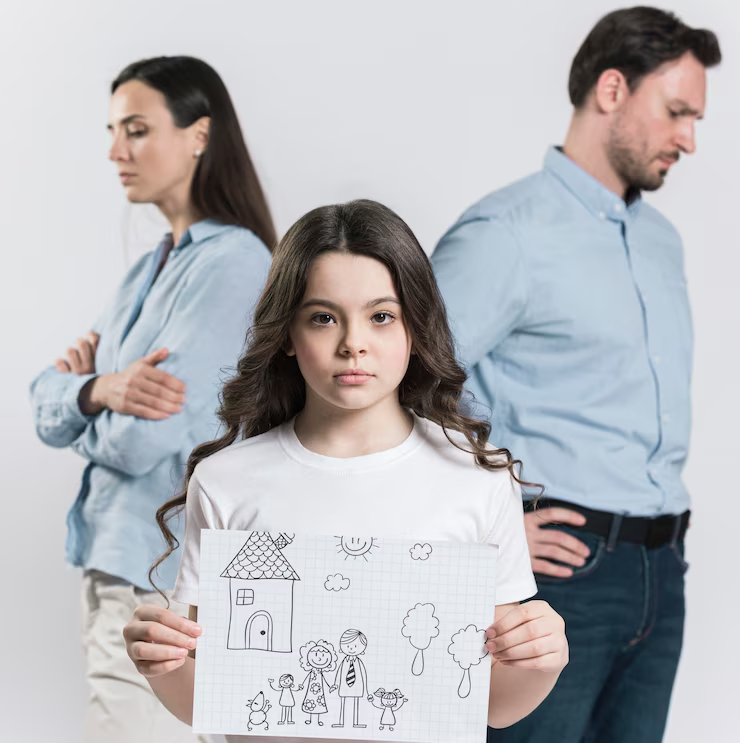 A kid holding a drawing