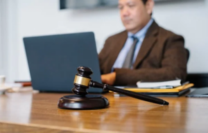Lawyer working at his office desk with a gavel and legal documents, offering support for child support cases