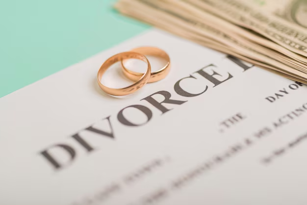 Two rings placed on a divorce form