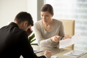 Divorce attorney with a stressed client during a contested divorce case