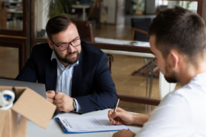 A child support attorney in Austin meeting with a client to discuss legal enforcement options for unpaid child support