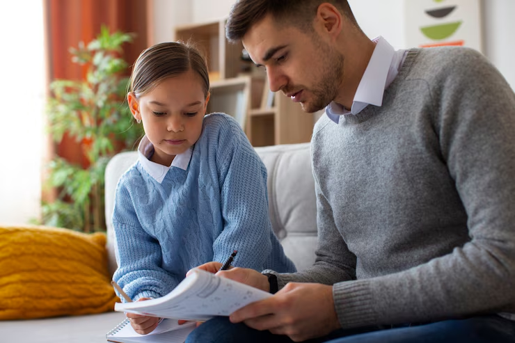 A father assisting his child with homework in a living room, highlighting the impact of unpaid child support on the child’s education