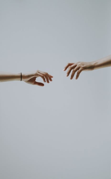 Couple of hands apart from one another