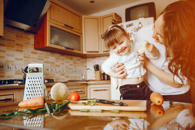 A mother and her daughter in a kitchen